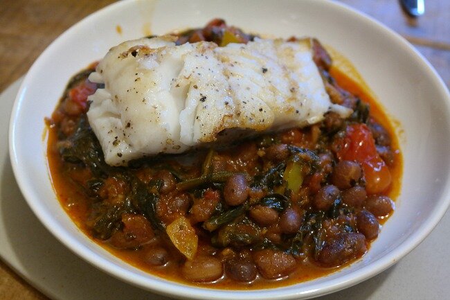 Plated cod and chorizo stew